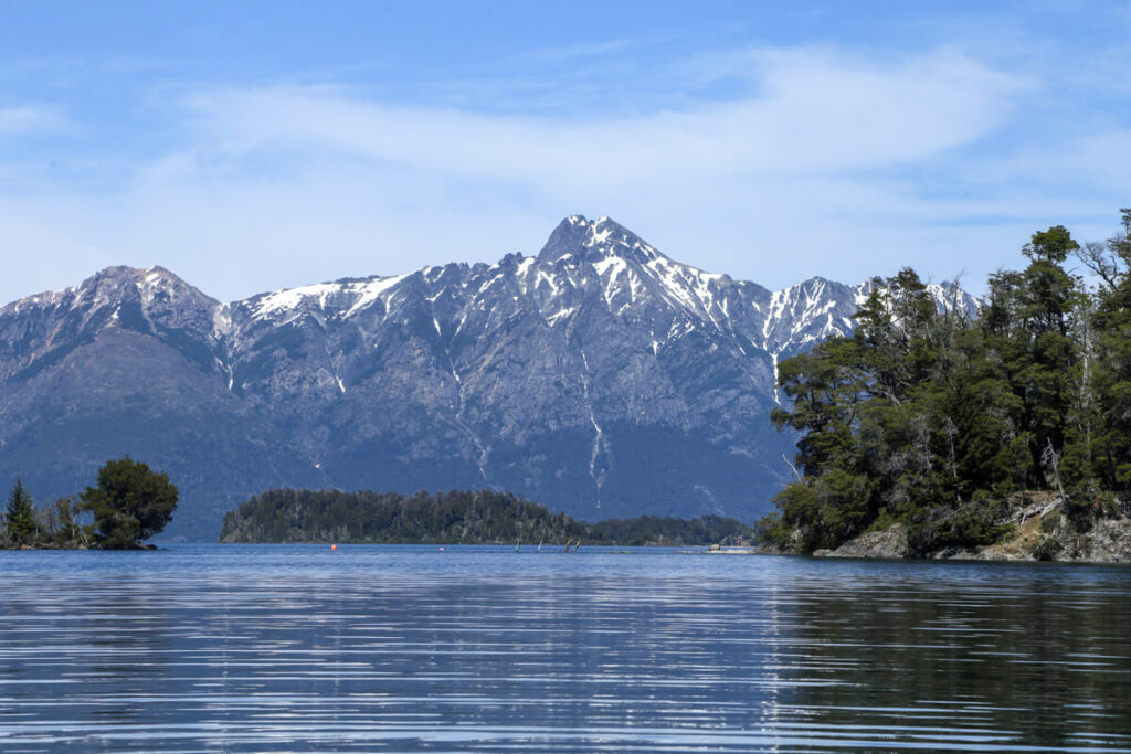 Mountains stand tall behind the lake in Bariloche