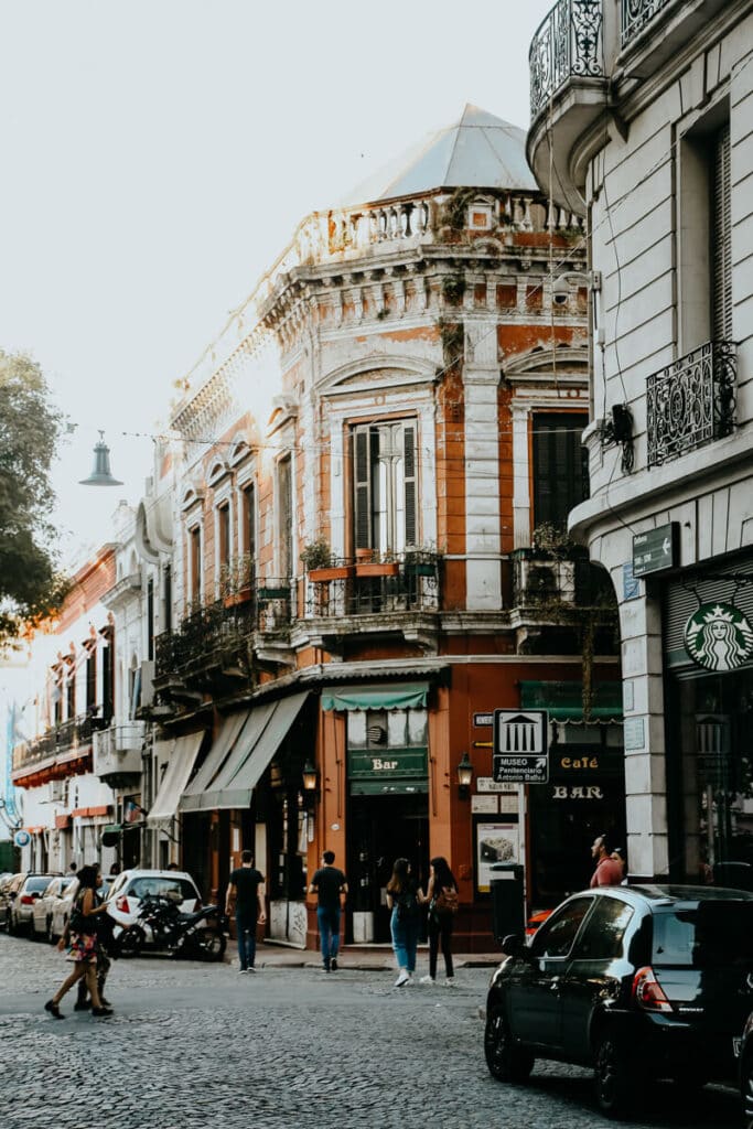 An old cafe street corner and a cobblestone street