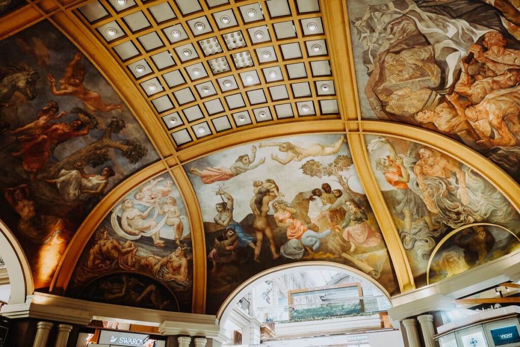 A dome painted with gold accents and murals