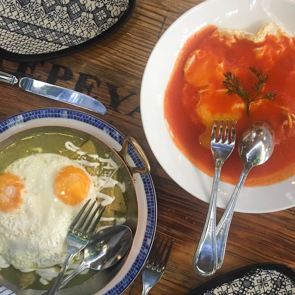 Two plates of tortillas and eggs