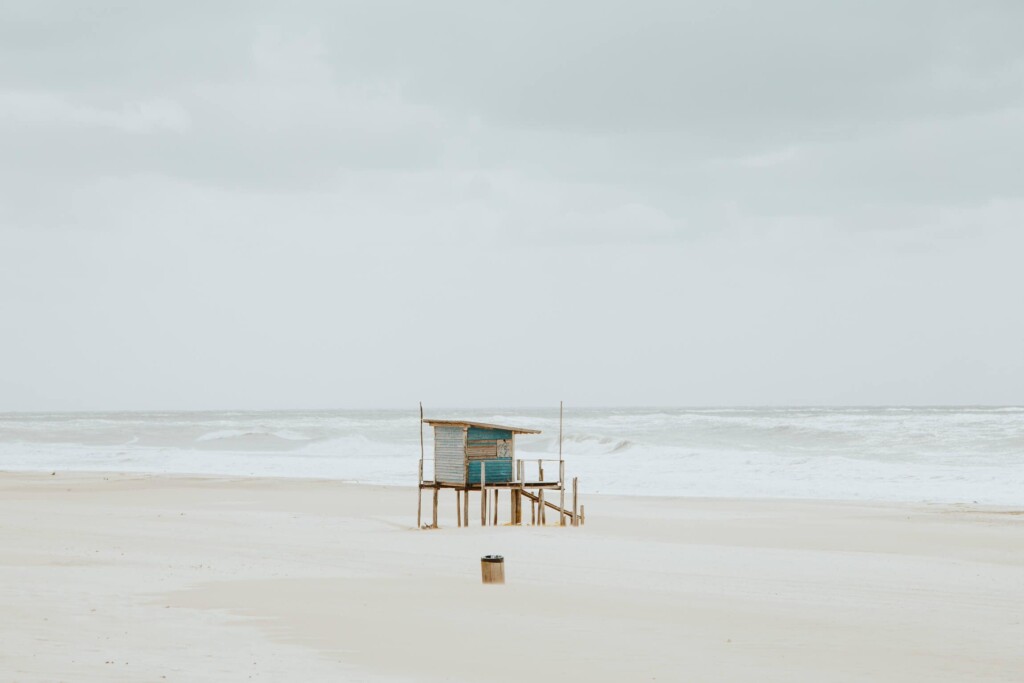 A blue lifeguard stand on the beach