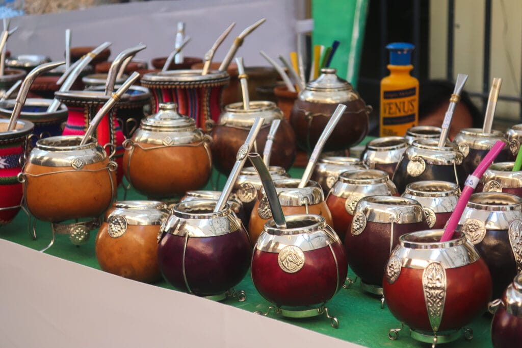 Silver mate gourds for sale in a market booth