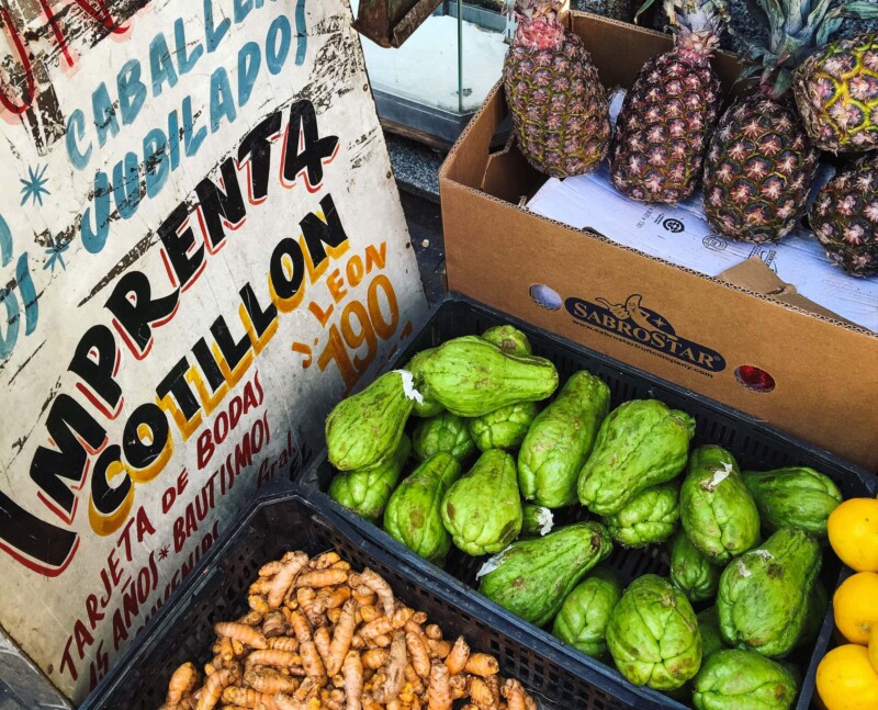 Plastic bins with pineapple and fruit