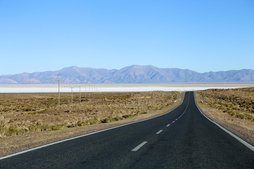 A two lane highway in the desert