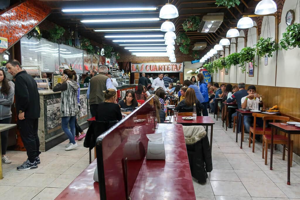 Tables and a bar at a Buenos aires pizzeria