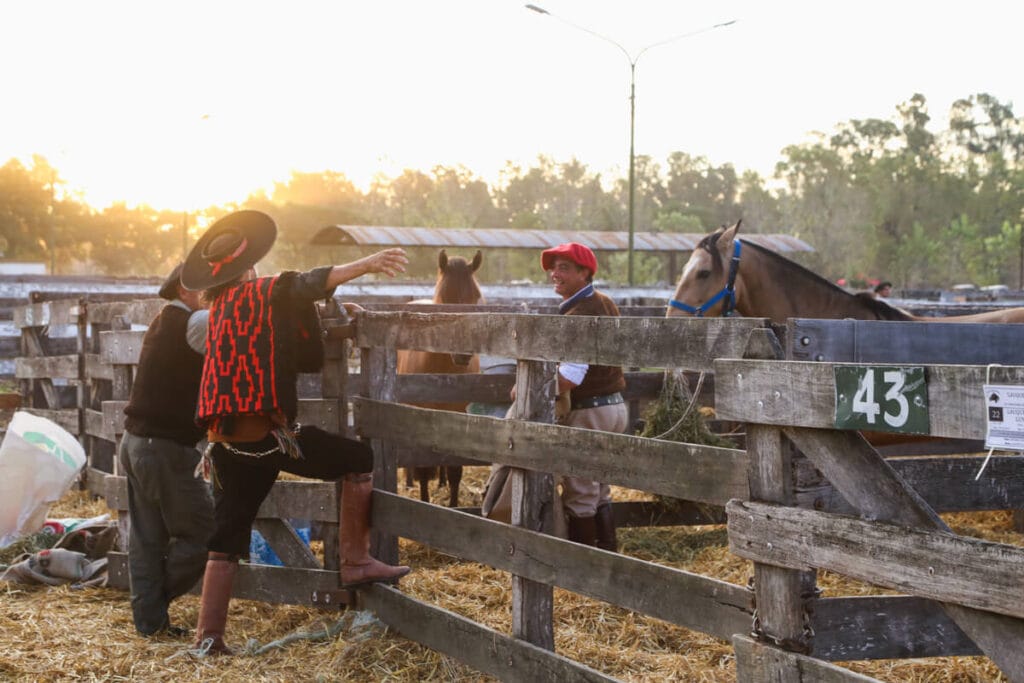 Gauchos and horses in the stables of a fairgrounds