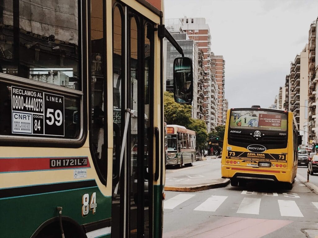 City buses on a busy avenue