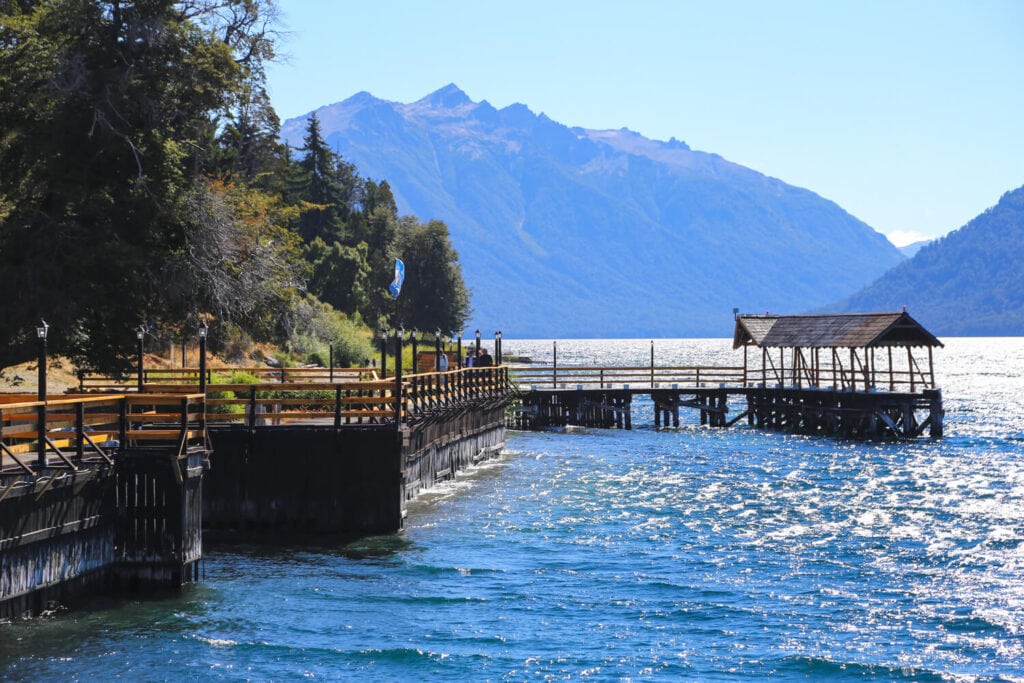 A wooden pier on a lake in the mountains