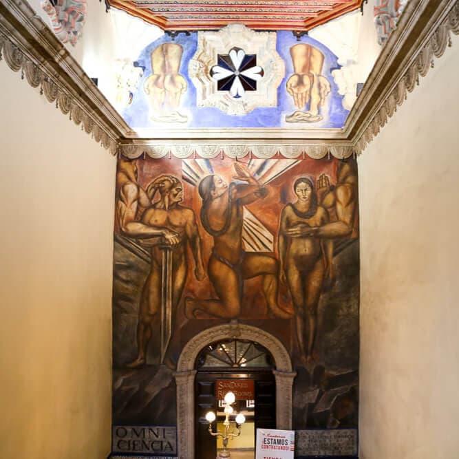 A mural against the wall of a stairwell in Mexico City