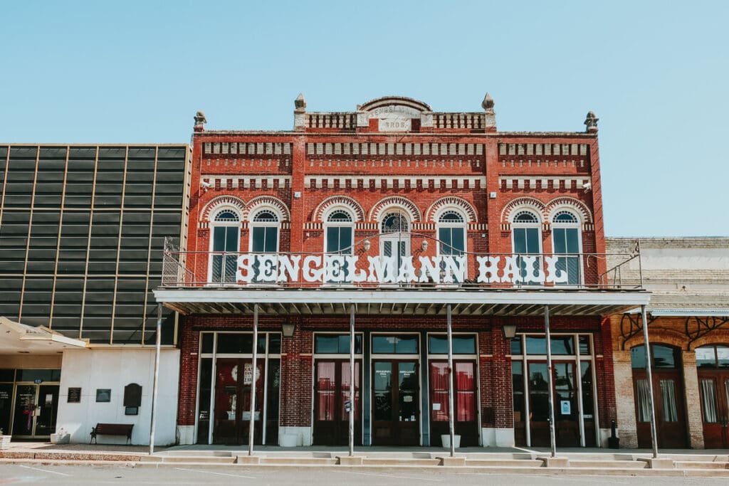 A red brick dance hall in a small town in Texas