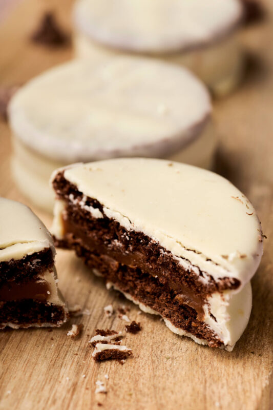 Half of a chocolate cookie bathed in white chocolate