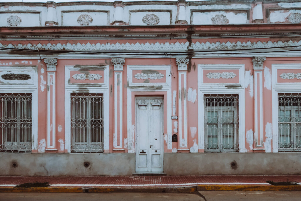 A pink facade of a historic building on a Buenos Aires day trip into the country