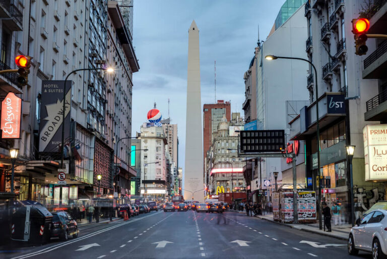 A four lane busy street leads to the obelisk on a busy Buenos Aires afternoon