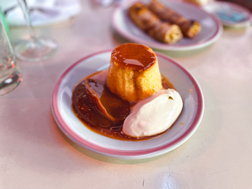 Argentine Flan, dulce de leche, and cream on a white dish