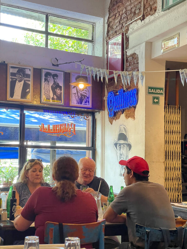 Four people dine at a table in Buenos Aires