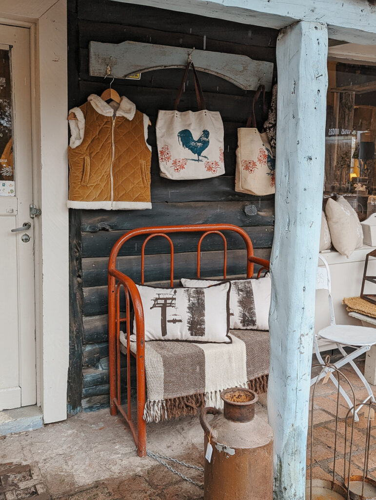 Sweaters and throw pillows on a porch of a souvenir shop in Bariloche